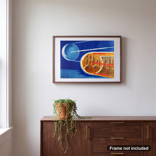 Soviet Sputnik 1958 | Cold War Propaganda Poster, shown framed on a wall. Frame not included.